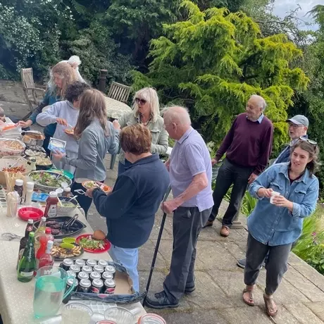 Church family sharing a meal outdoors